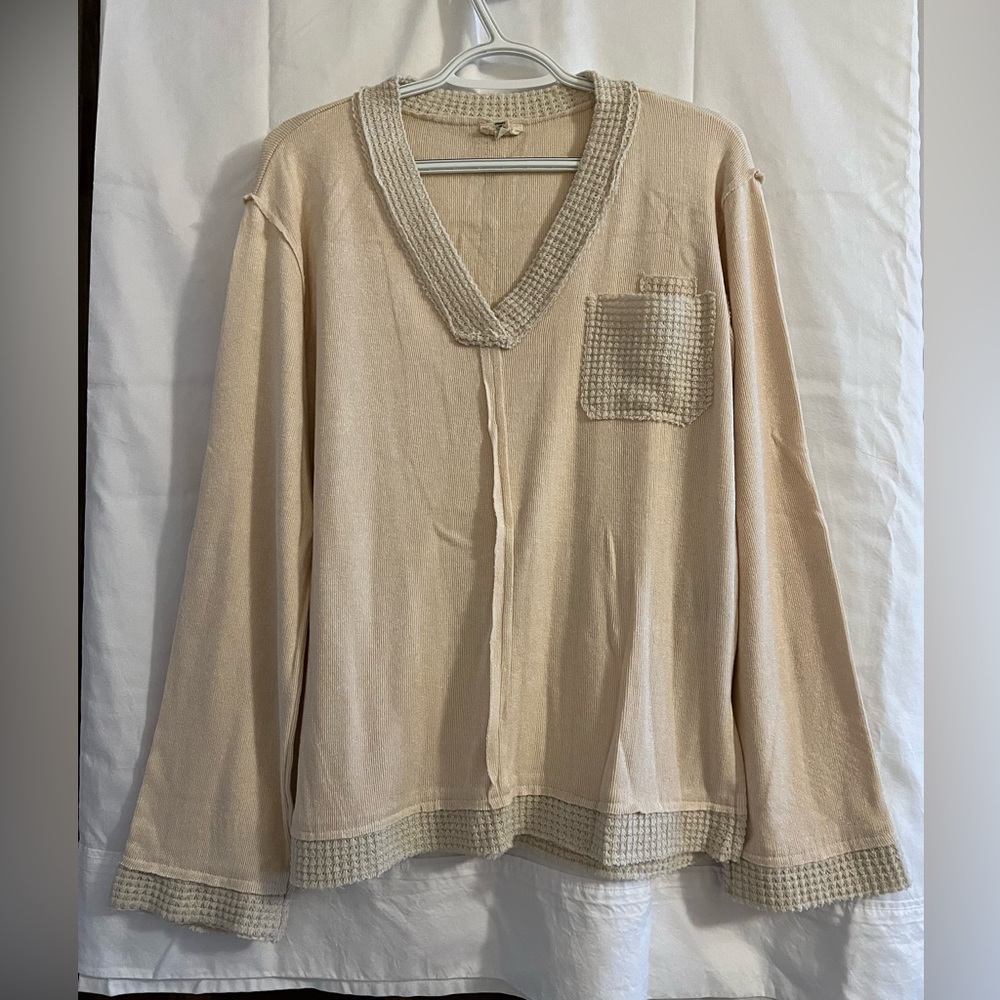 Soft v-neck bell-sleeve sweater.
